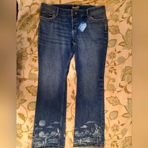 Wrangler Ladies Boot Cut jeans in a size 17x34. They have a design on the legs.